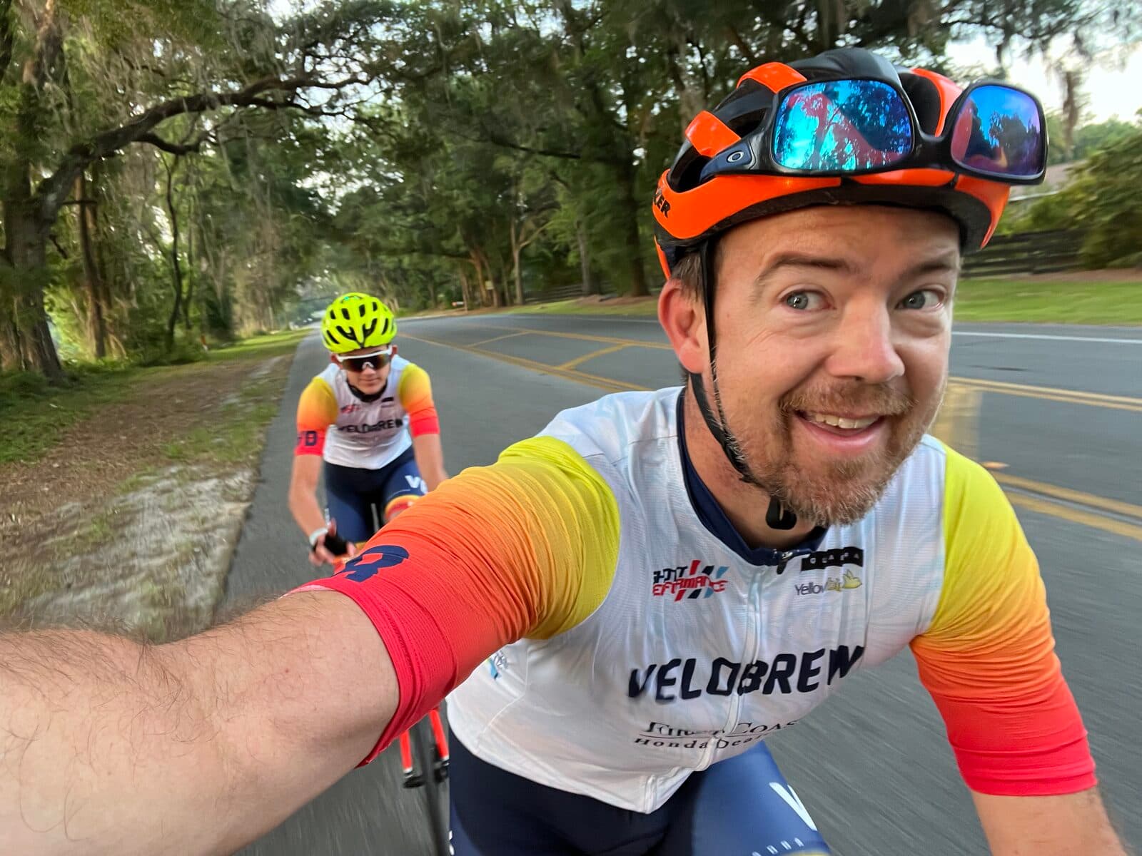 Jason and Olen Lokkesmoe riding together — father and son co-founders of Pro Cycling Coach